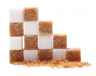 Brown and white cane sugar cubes isolated.