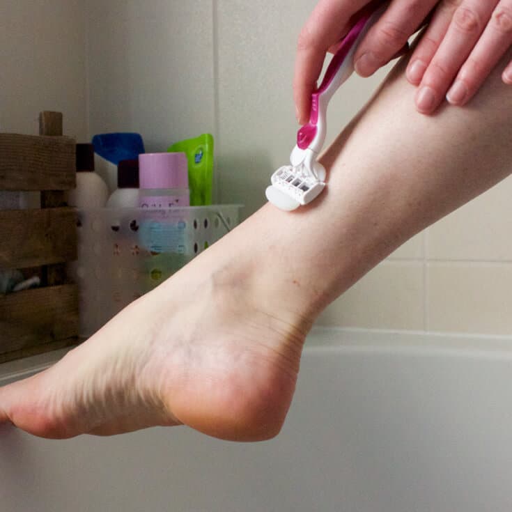 Woman Shaving Legs