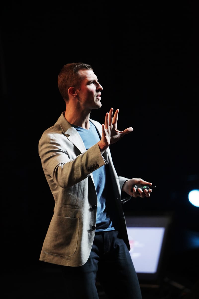 Dr. Josh Axe speaking on stage at CAL JAM