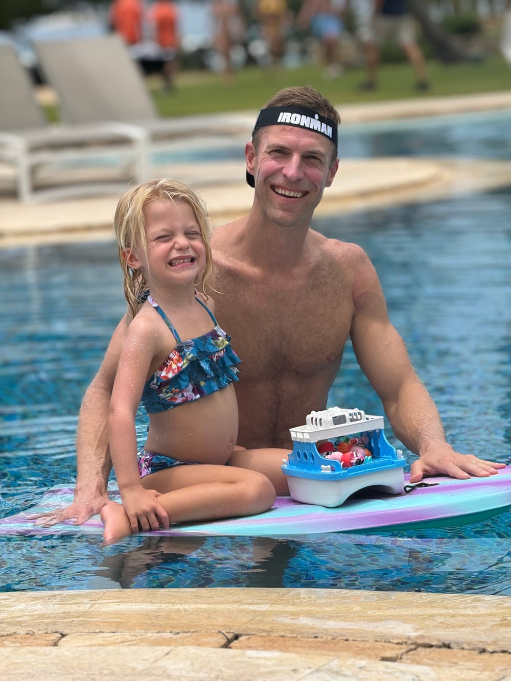 Dr. Josh Axe fully recovered, in the pool with his daughter