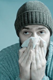 Man with a Cold blowing nose 