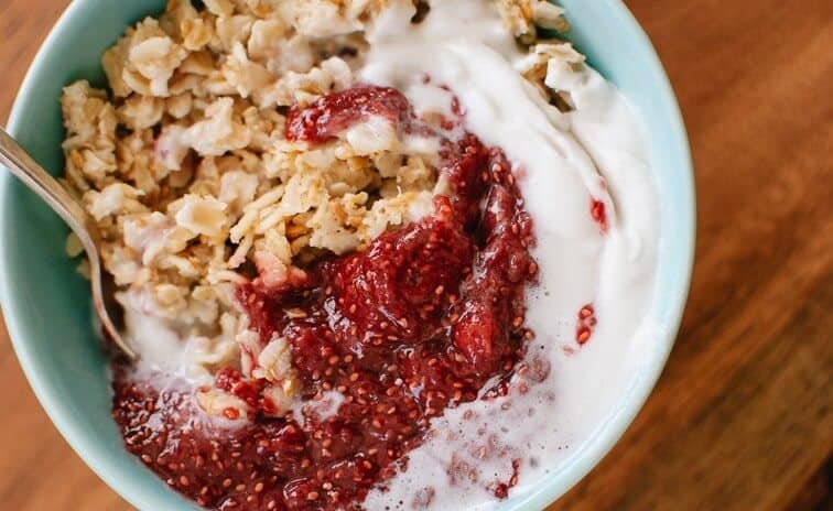 toasted oatmeal with strawberry chia jam and coconut whipped cream