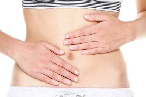 woman's hands on stomach