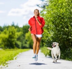 woman running with dog