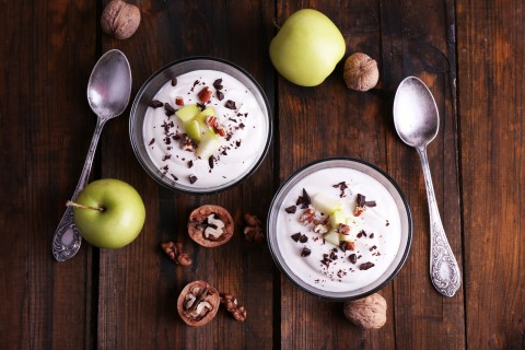 yogurt in bowls with apple and walnut
