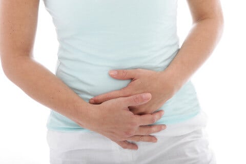 bloating and gas pain, holding stomach