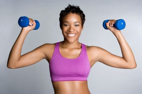 Black Woman Exercising lifting weights