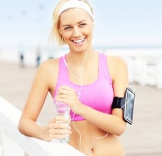 Young woman exercising with arm band