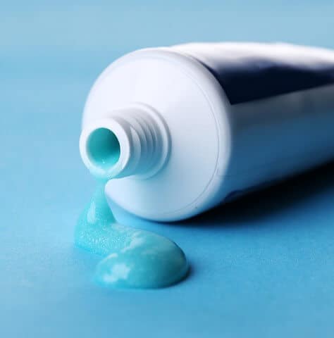 toothpaste dripping from tube