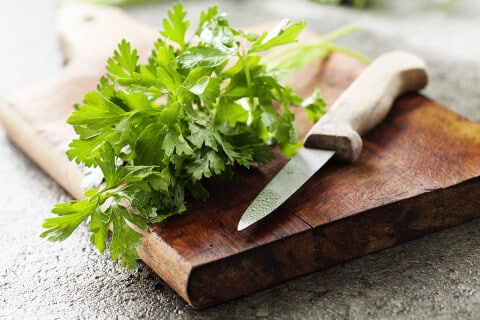 bunch of parsley on cutting board