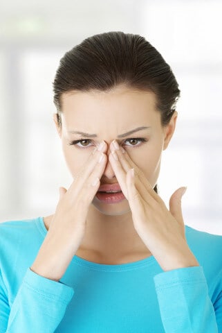 woman with sinusitis, head cold
