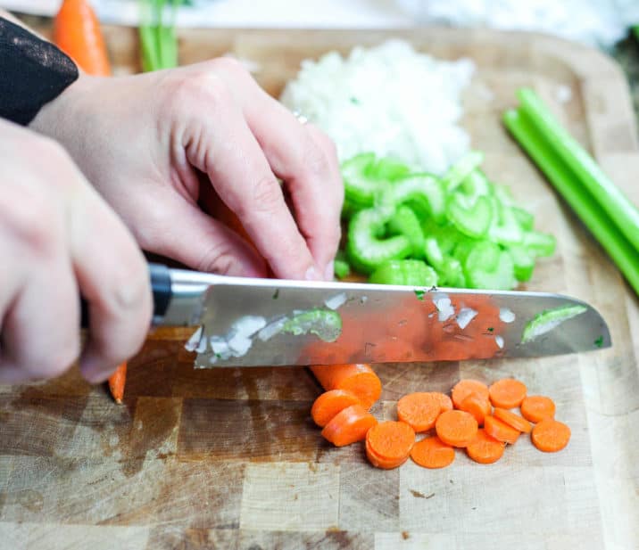 Chopping carrots - Dr. Axe