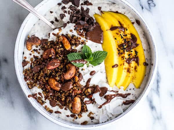 Coconut Banana Oats Bowl with Crunchy Black Sesame Quinoa Cereal and Mango