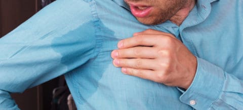 low temperature and sweating in adults
